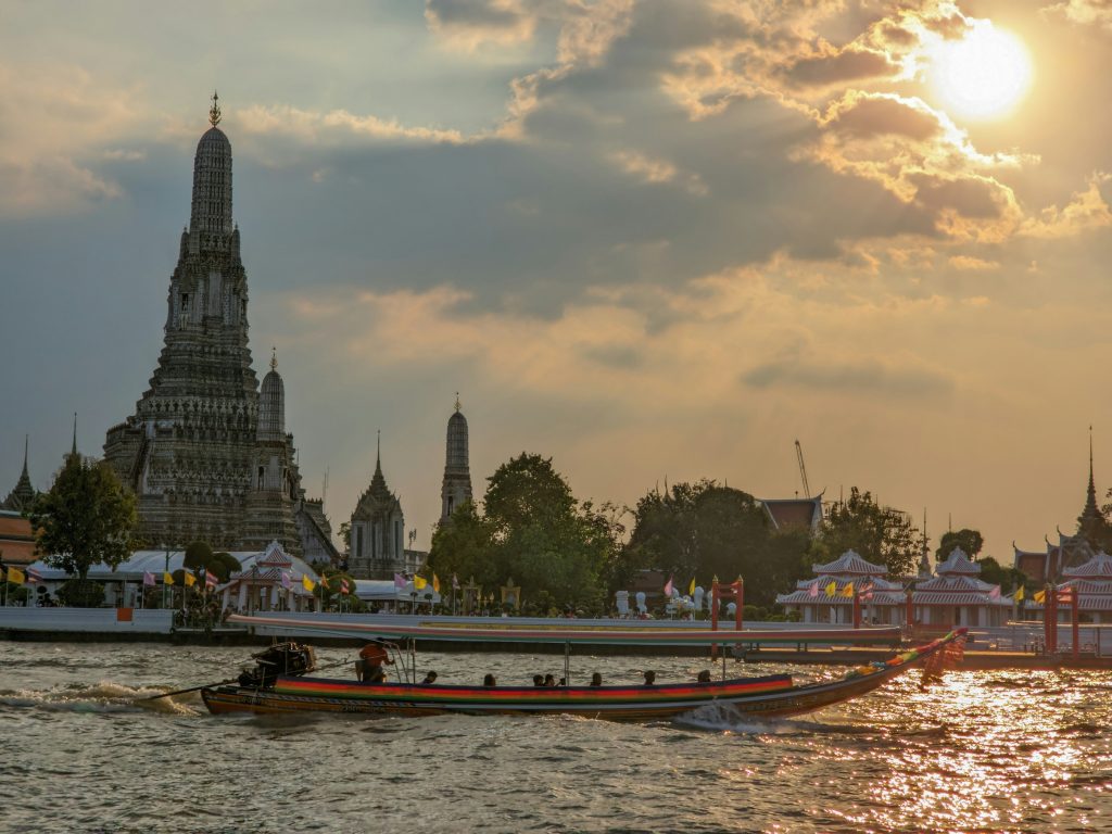 Grand Palace along the Chao Phraya River at sunset